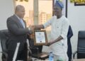 CRFFN Registrar receiving his certificate of appointment as a member of the Maritime Media & Capacity Development Centre (MMCDC)
