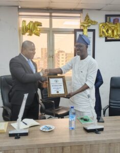 CRFFN Registrar receiving his certificate of appointment as a member of the Maritime Media & Capacity Development Centre (MMCDC)