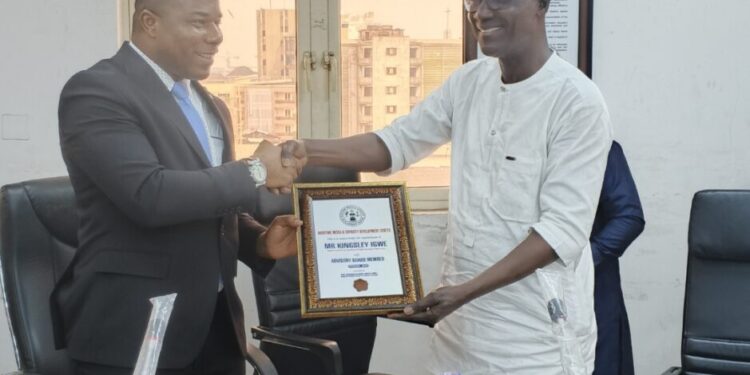 CRFFN Registrar receiving his certificate of appointment as a member of the Maritime Media & Capacity Development Centre (MMCDC)