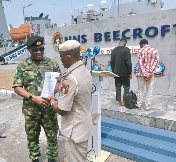 NNS Beecroft Hands Over Two Suspected Stowaways to Immigration Service